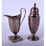A SILVER CREAM JUG and a silver sifter. Birmingham 1917 & 1949. 164 grams. Largest 15.5 cm high. (2)