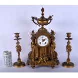 A LARGE 19TH CENTURY FRENCH GILT BRONZE CLOCK GARNITURE formed with putti seated under a floral pain