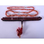 AN EARLY 20TH CENTURY MIDDLE EASTERN RED CHERRY AMBER TYPE PRAYER NECKLACE together with two other c