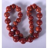 A VINTAGE RED BEAD NECKLACE. 54 grams. 38 cm long.