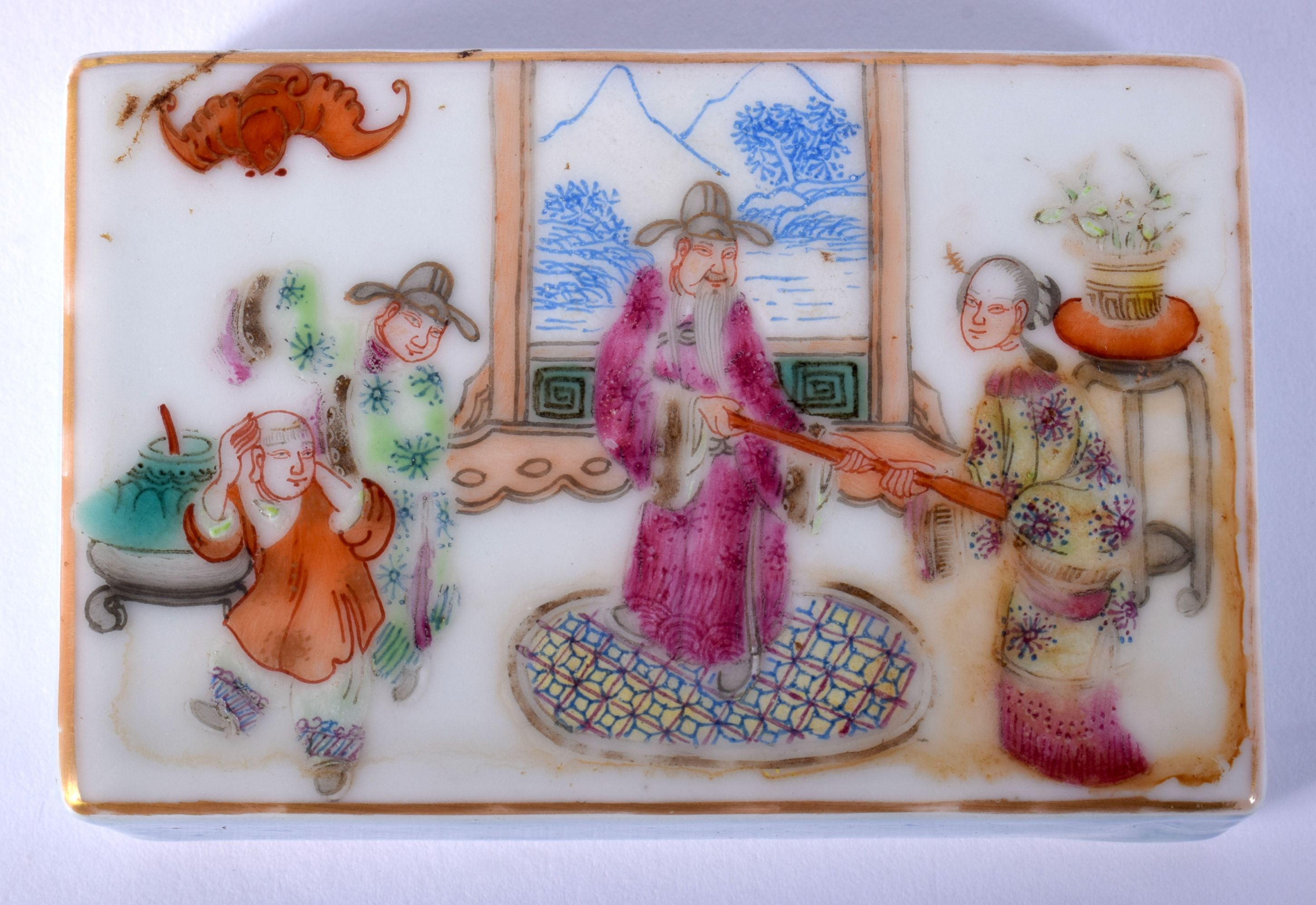 A CHINESE QING DYNASTY FAMILLE ROSE PORCELAIN SCROLL WEIGHT painted with figures within interiors. 7