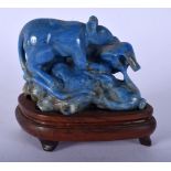 AN EARLY 20TH CENTURY CHINESE CARVED LAPIS LAZULI FIGURE OF A RAT modelled upon a naturalistic base.