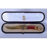 A BOXED CONTINENTAL SILVER GILT ENAMEL AND DIAMOND LETTER OPENER with dog terminal. 44 grams. 15 cm