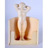 A RARE EARLY 20TH CENTURY EUROPEAN IVORY FIGURE OF A NUDE FEMALE modelled bathing. 11 cm x 7 cm.