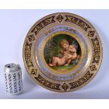 A FINE LARGE 19TH CENTURY VIENNA PORCELAIN CABINET PLATE painted with putti within a gilt embellishe