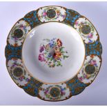 A LATE 19TH CENTURY FRENCH SEVRES STYLE PORCELAIN PLATE painted with flowers. 22 cm diameter.