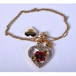 A HEART FORM NECKLACE. 12 grams. 46 cm long, Pendant 3.25 cm x 3 cm.