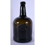 AN ANTIQUE OLIVE GREEN ARMORIAL WINE BOTTLE probably early 18th century. 23 cm high.