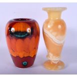 A POOLE POTTERY VASE and an alabaster vase. Largest 22 cm high. (2)