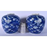 A LARGE PAIR OF 19TH CENTURY CHINESE BLUE AND WHITE GINGER JARS Qing, bearing Kangxi marks to base,