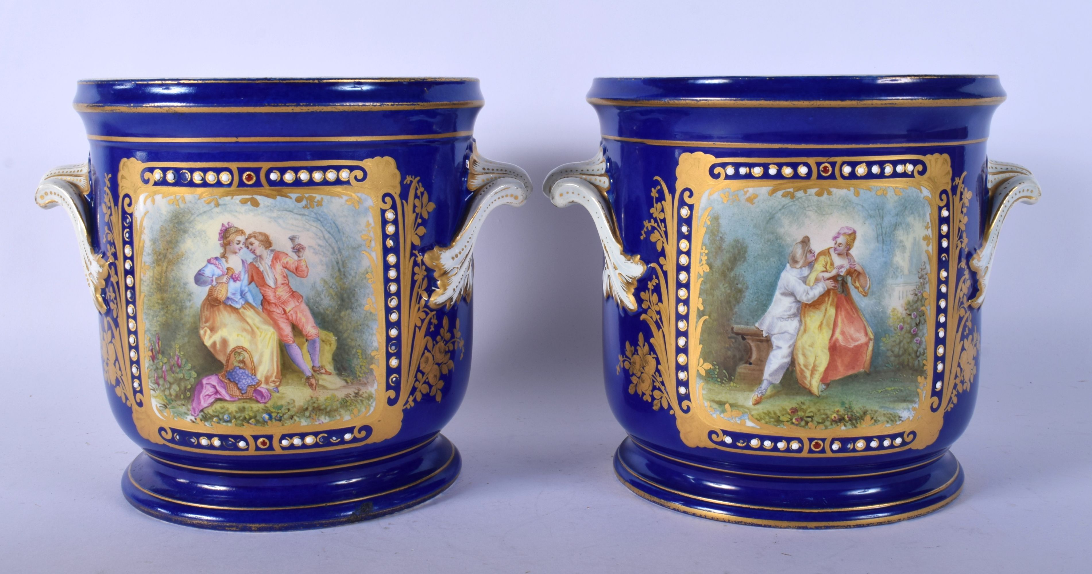 A PAIR OF 19TH CENTURY FRENCH SEVRES PORCELAIN TWIN HANDLE CACHE POT painted with lovers in landscap