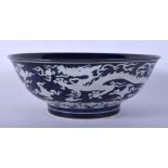 A CHINESE POWDER BLUE PORCELAIN BOWL 20th Century, painted with dragons. 17.5 cm diameter.