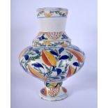 A TURKISH MIDDLE EASTERN IZNIK KUTAHYA IZNIK VASE painted with flowers. 22 cm high.