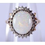 A 9CT GOLD OPAL AND DIAMOND RING. M. 3.4 grams.