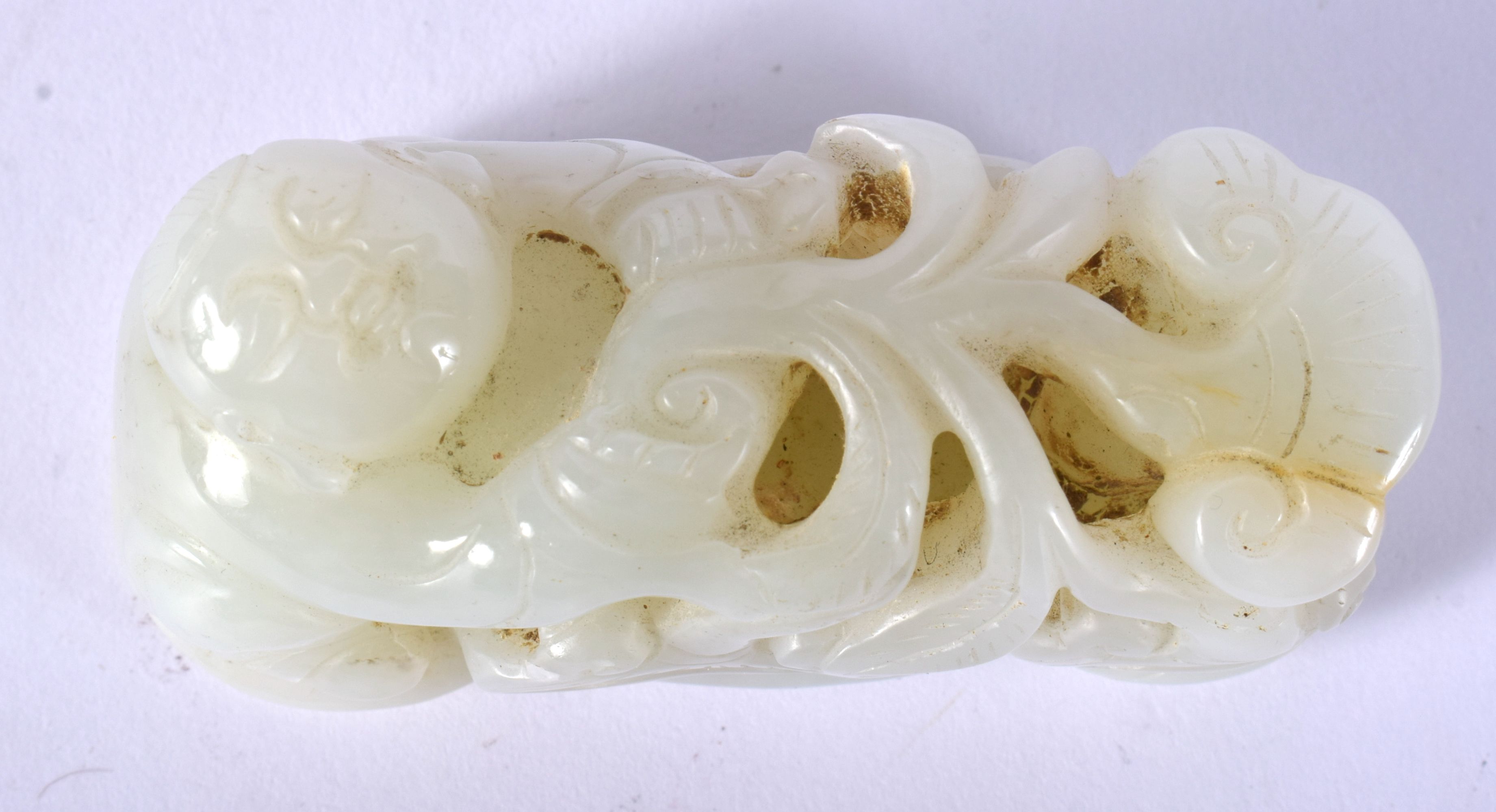 A CHINESE CARVED GREENISH WHITE JADE FIGURE OF A BOY 20th Century, modelled holding lingzhi fungus. - Image 3 of 12