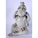A 19TH CENTURY CHINESE BLANC DE CHINE PORCELAIN FIGURE OF A MALE modelled with an attendant. 21 cm x