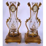 A PAIR OF ART NOUVEAU FRENCH CRYSTAL GLASS AND IVORY VASES painted with portraits. 26 cm high.