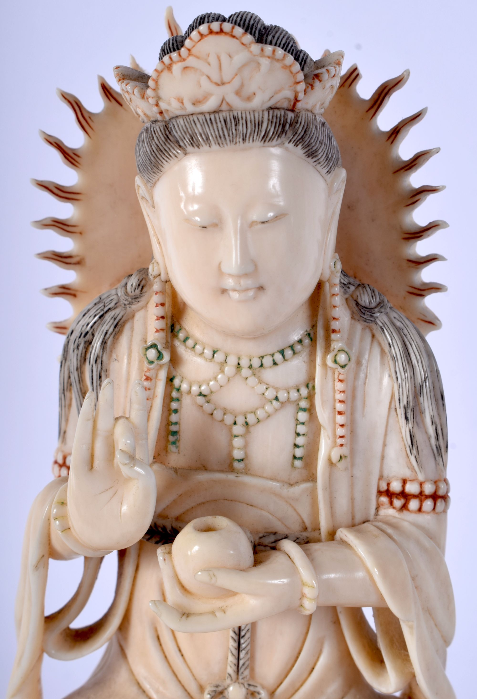 A 19TH CENTURY CHINESE POLYCHROMED IVORY FIGURE OF A SEATED DEITY modelled holding a censer. 16 cm x - Image 4 of 5