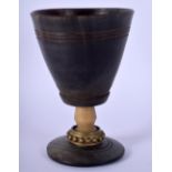 AN 18TH/19TH CENTURY GERMAN CARVED RHINOCEROS HORN GOBLET BEAKER with stud work collar. 182 grams. 1