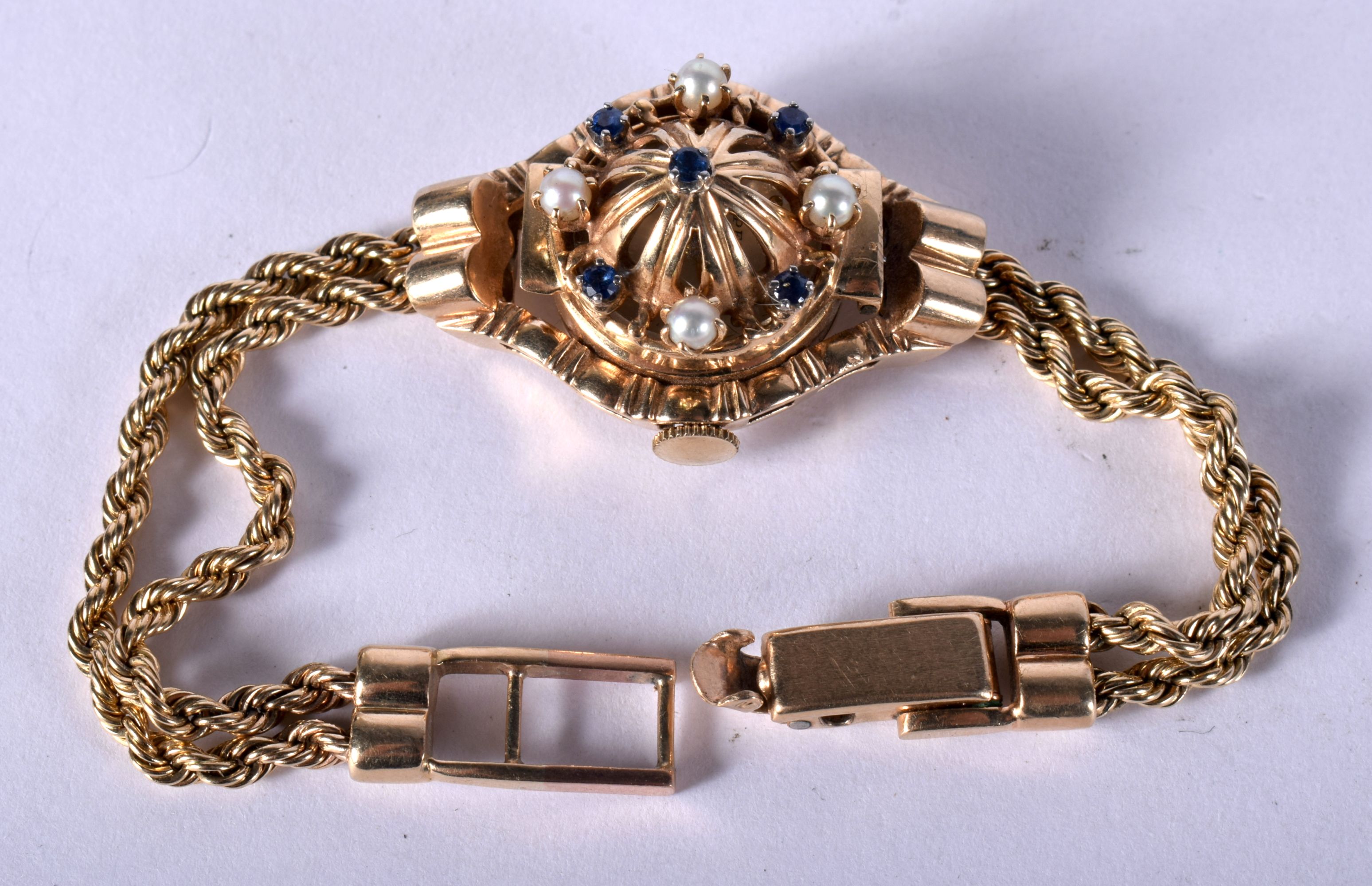 A VINTAGE 14CT GOLD PEARL AND SAPPHIRE COCKTAIL WRISTWATCH, 30.6 grams. 17 cm long, dial 2.5 cm wide