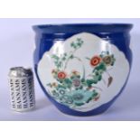 A 19TH CENTURY CHINESE POWDER BLUE GROUND PORCELAIN JARDINIERE Guangxu, painted with foliage and vin