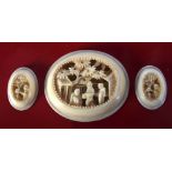 THREE 19TH CENTURY CHINESE CANTON IVORY PLAQUES. 12 grams. Largest 3.75 cm x 3 cm. (3)
