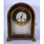 AN ANTIQUE TORTOISESHELL CASED MANTEL CLOCK with brass dial. 27 cm x 17 cm.