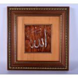 A TURKISH OTTOMAN CARVED WOOD CALLIGRAPHY PANEL. 38 cm square.