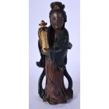 A 19TH CENTURY CHINESE FOO CHOW TYPE LACQUER FIGURE OF A FEMALE modelled holding an urn. 17 cm high.