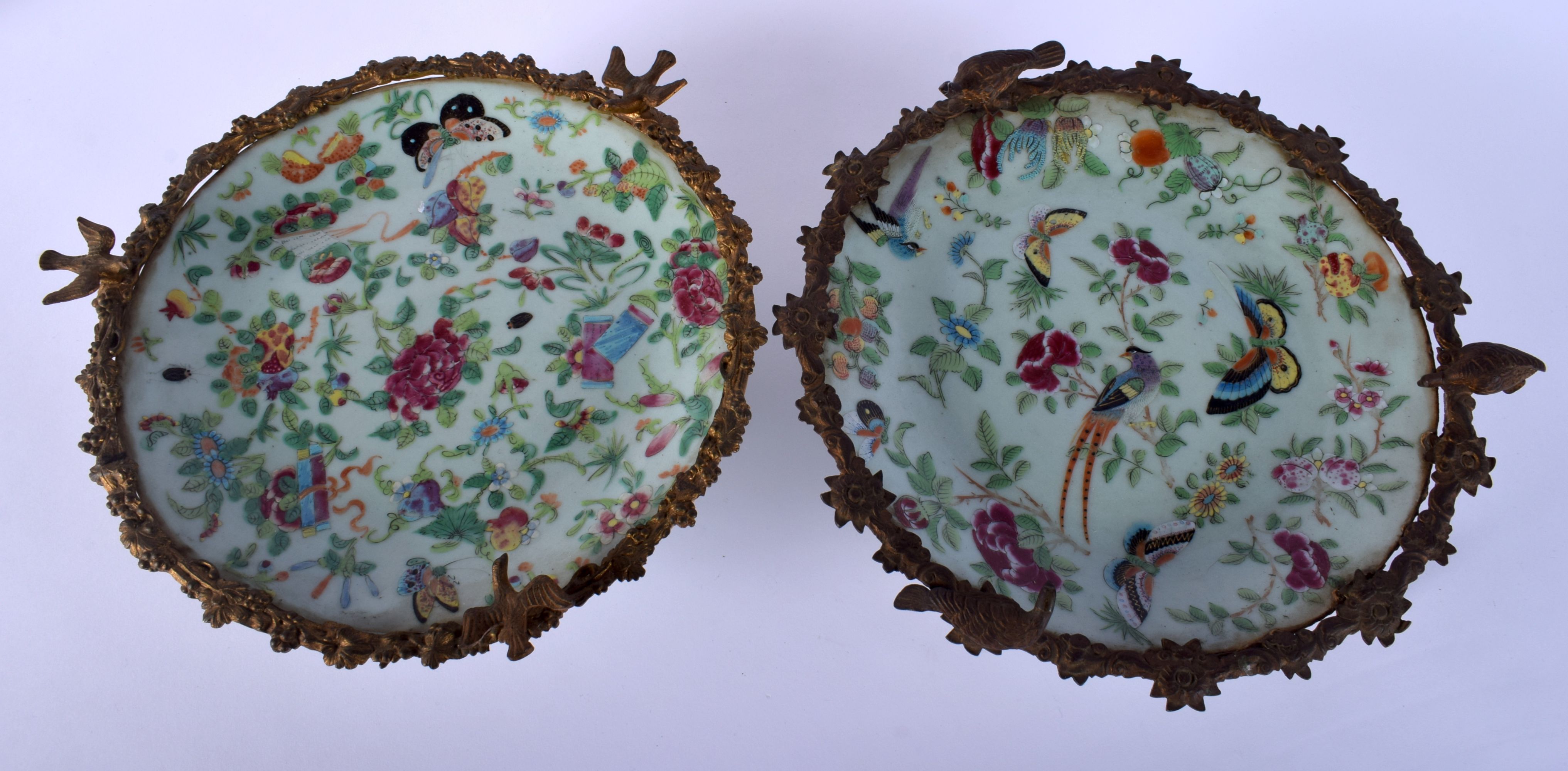 A PAIR OF 19TH CENTURY CHINESE CELADON FAMILLE ROSE DISHES with French bronze mounts. 25 cm wide.