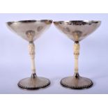 A PAIR OF STYLISH EARLY 20TH CENTURY SILVER AND IVORY TAZZAS by Wetzlar. 295 grams. 16 cm x 8 cm.
