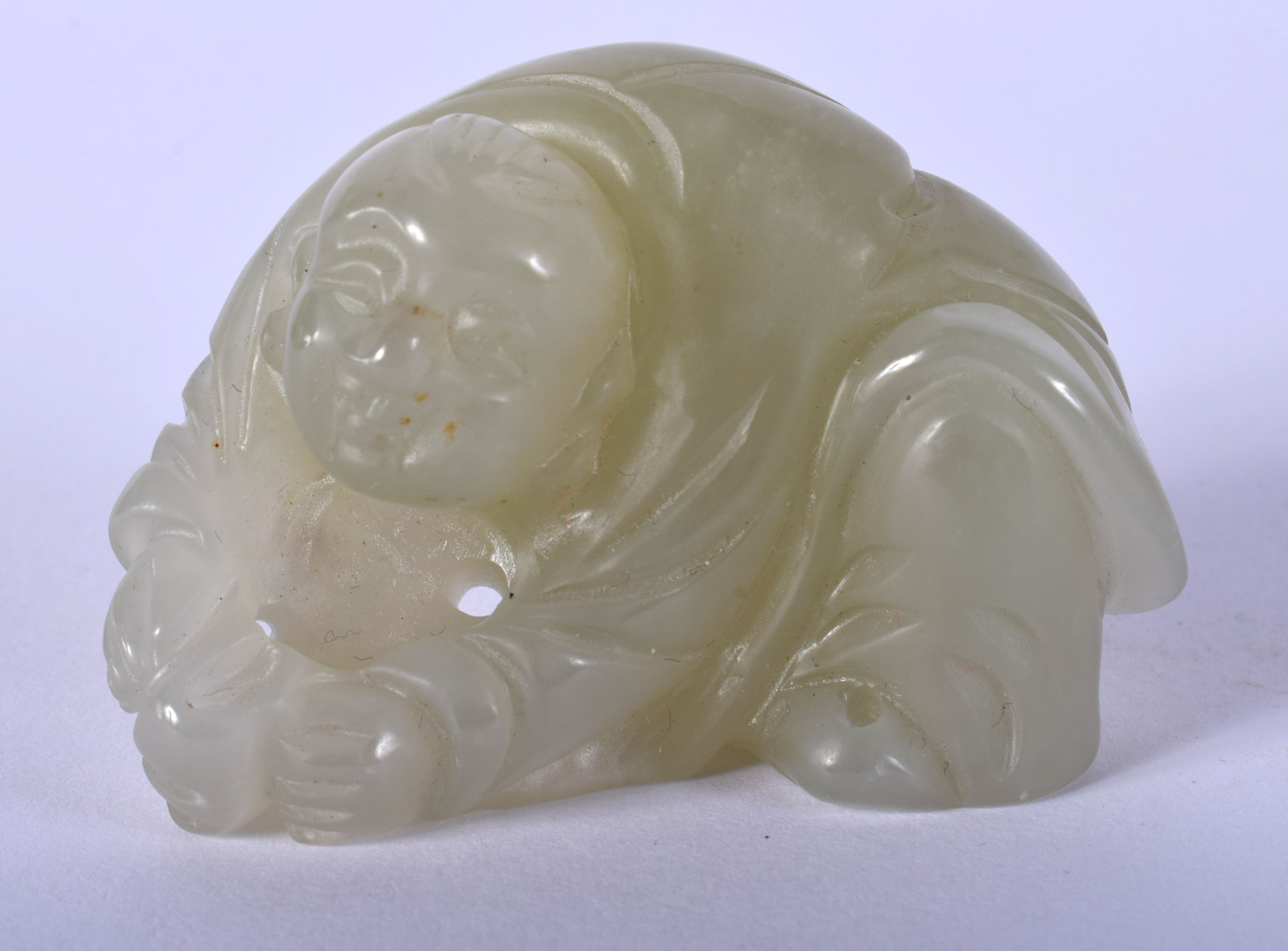 AN EARLY 20TH CENTURY CHINESE CARVED JADE FIGURE OF A BOY Late Qing/Republic. 5.5 cm x 3.5 cm.