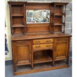 A VERY LARGE ARTS AND CRAFTS MIRROR BACK SIDEBOARD DISPLAY CABINET with multiple shelves and doors.
