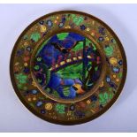 A FINE WEDGWOOD FAIRYLAND LUSTRE CIRCULAR PLATE by Daisy Makeig Jones, painted with figures and land