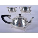 AN ARTS AND CRAFTS ENGLISH SILVER THREE PIECE TEASET. 740 grams. Largest 23 cm wide. (3)