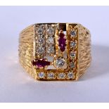 AN 18CT GOLD DIAMOND AND RUBY RING. 12.7 grams. T.