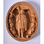 AN UNUSUAL EARLY 20TH CENTURY RUSSIAN CARVED WOOD OVAL PLAQUE depicting a standing male. 10.5 cm x 7