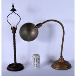 A VINTAGE INDUSTRIAL BRONZE DESK LAMP together with a bronze lamp. Largest 72 cm high. (2)