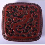 A 19TH CENTURY CHINESE CARVED RED LACQUER SQUARE BOX AND COVER carved with dragons and foliage. 7.5