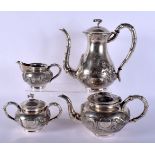 A 19TH CENTURY CHINESE EXPORT FOUR PIECE SILVER TEASET decorated with dragons. 2225 grams. Largest 2