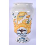 AN ANTIQUE ITALIAN FAIENCE TIN GLAZED DRUG JAR painted with birds. 22 cm x 10 cm.