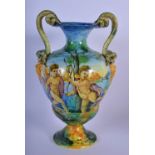 A 19TH CENTURY ITALIAN TWIN HANDLED MAJOLICA FAIENCE CANTAGALLI VASE painted with putti within lands