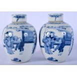 A PAIR OF 19TH CENTURY CHINESE BLUE AND WHITE PORCELAIN GINGER JARS AND COVERS painted with figures.