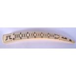 AN ANTIQUE WALRUS TUSK SCRIMSHAW CRIBBAGE BOARD. 42 cm long.