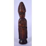 AN 18TH CENTURY EUROPEAN CARVED FRUITWOOD FIGURE OF A CARDINAL modelled wearing etched robes. 14 cm