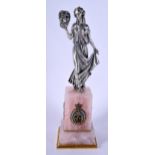 A CHARMING BOXED CONTINENTAL SILVER ENAMEL AND RUBY FIGURE modelled upon a rose quartz base. 645 gra