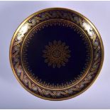 19TH C. SEVRES CIRCULAR DISH DECORATED INGOLD AND PLATINUM ON A DEEP BLUE GROUND. 17.5cm diameter