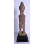 AN UNUSUAL EARLY 20TH CENTURY SOUTH AMERICAN CARVED STONE FIGURE OF A MALE. 30 cm high.