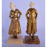 A PAIR OF ART DECO BRONZE AND IVORY FIGURES modelled as a male and female. 17 cm high.