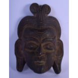 A 19TH CENTURY MIDDLE EASTERN ASIAN CARVED WOOD MASK depicting a long eared male. 25 cm x 15 cm.